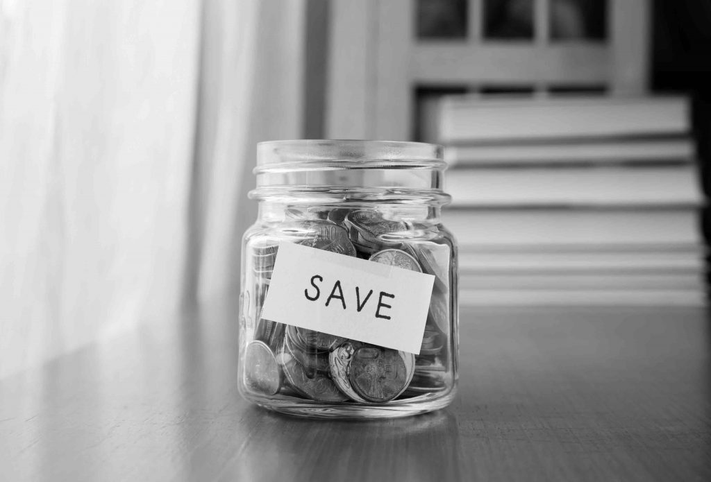 A jar full of coins with a label "save" illustrating that teams may not always need more money and resources