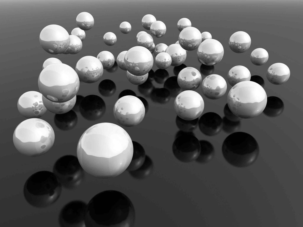 Metallic balls floating in the air, representing the proliferation of microsites in a company