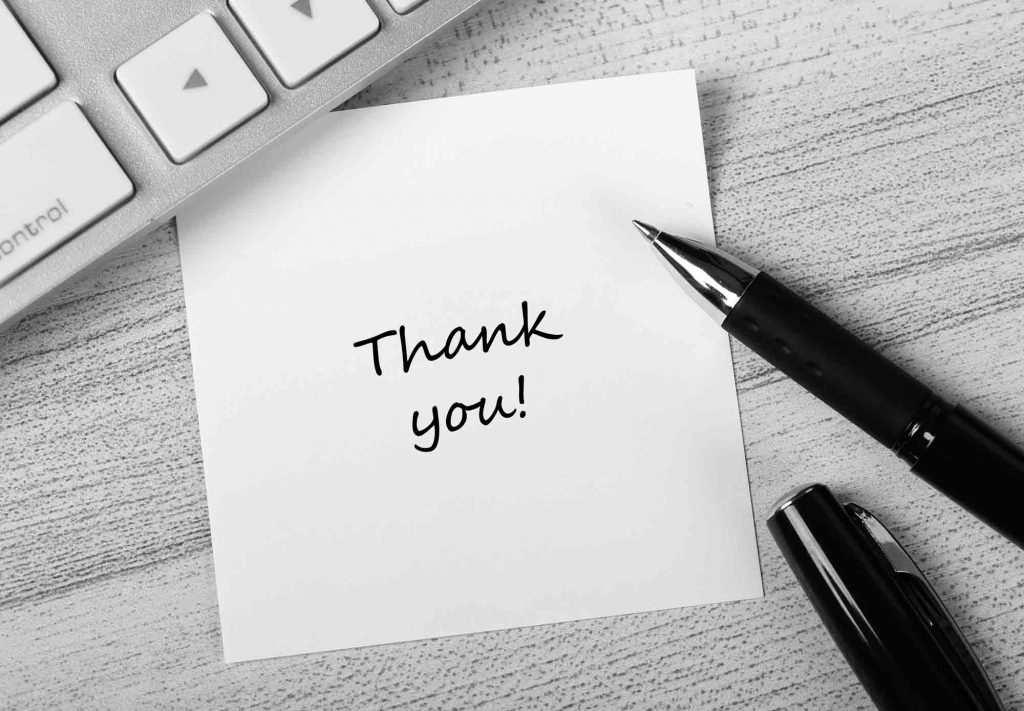 Hand written note with "thank you" to clients